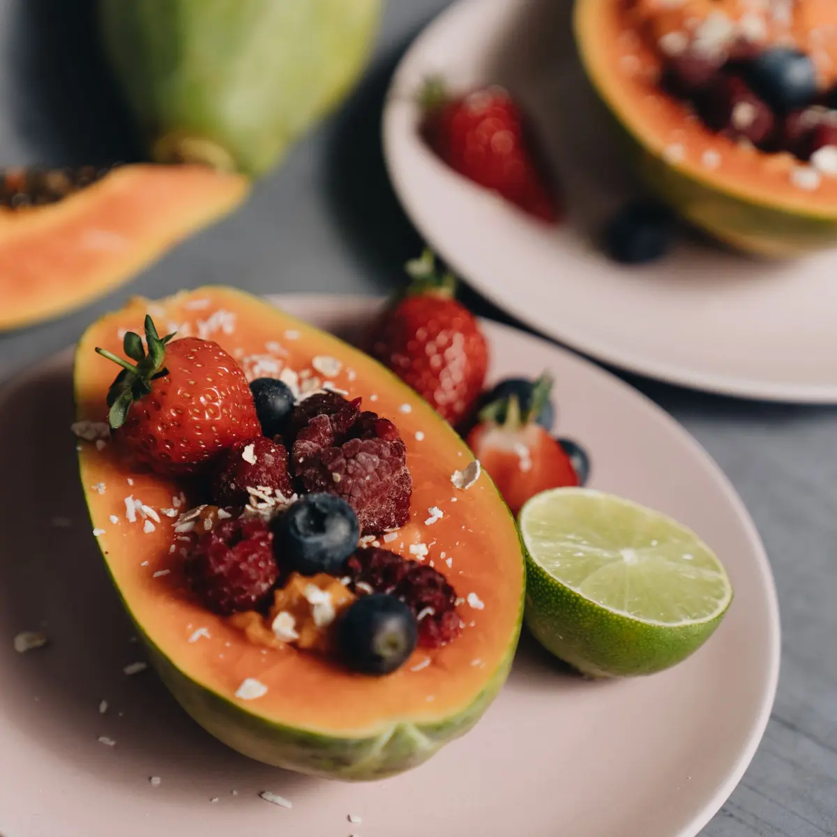 Papaya with berries and lime