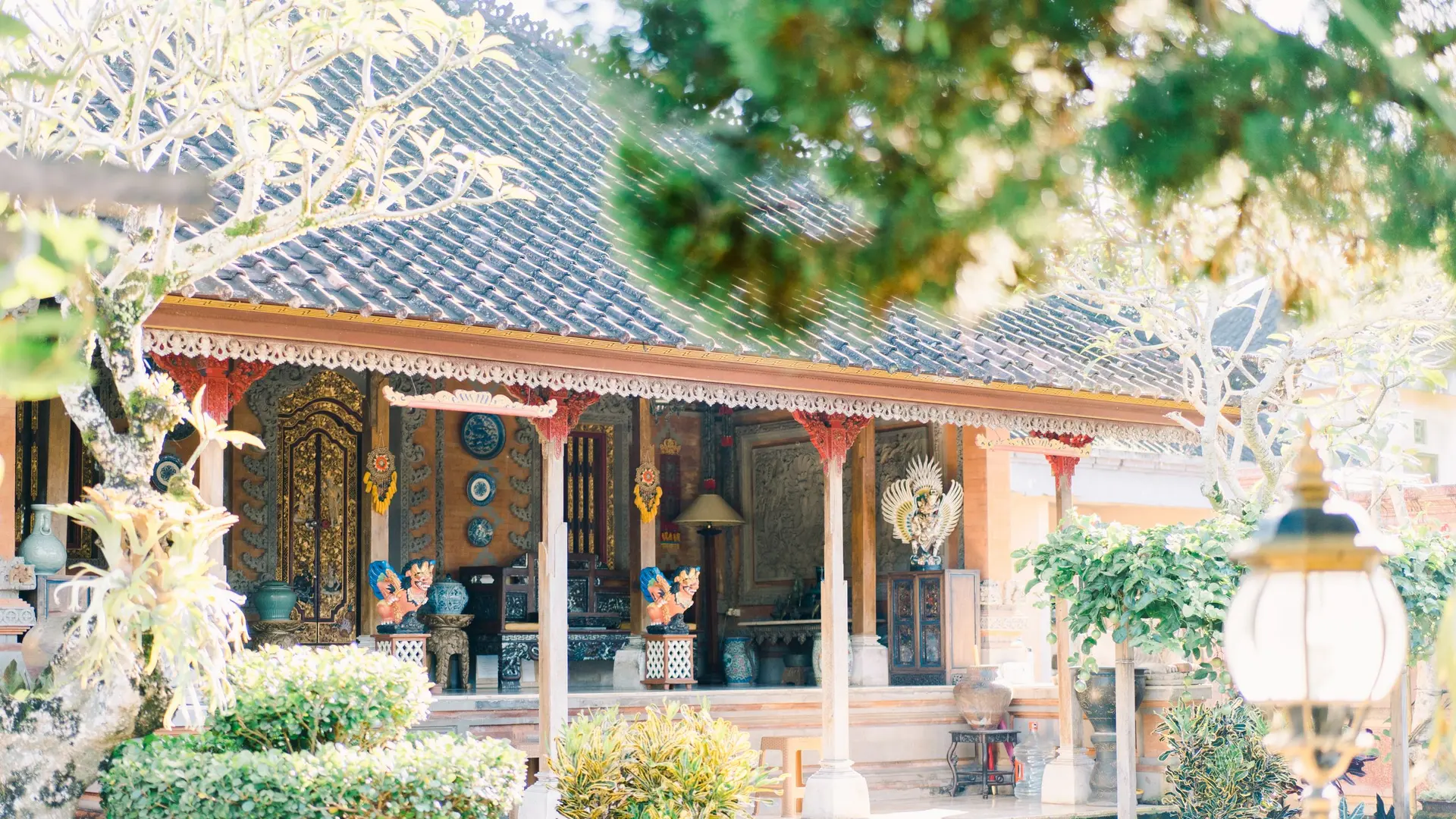 Balinese house surrounded by a flowering garden
