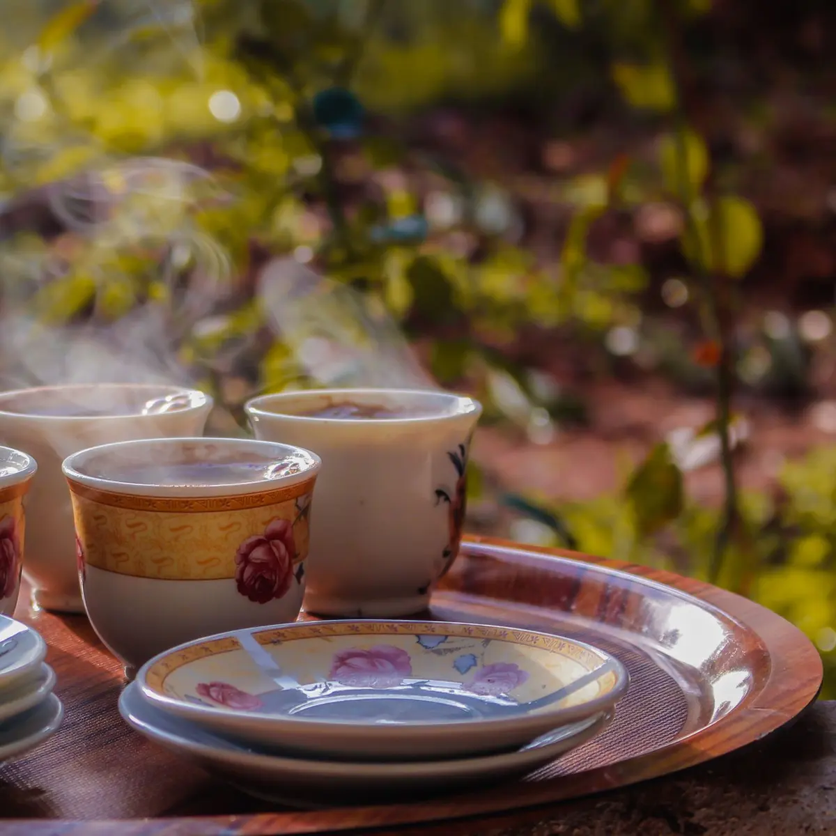 Tea cups on a tray outdoors